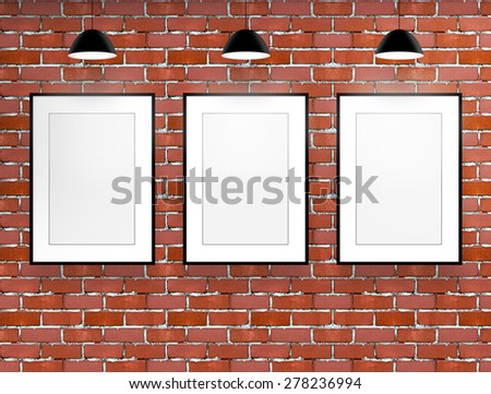 three blank frame in red brick loft room