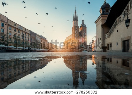 Market square and St. Mary's Basilica in Krakow, Poland. Royalty-Free Stock Photo #278250392