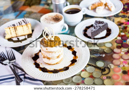 Fresh Italian Dulce de Leche with coffee on the table. Royalty-Free Stock Photo #278258471