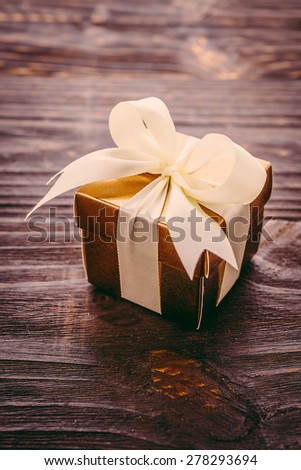 Gift box on wooden background - Vintage effect style pictures