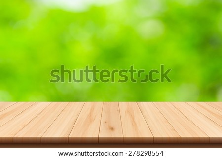 Abstract nature blurred background with bokeh and wooden floor