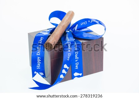 Happy Father's Day with a gift box and cuban cigar close up