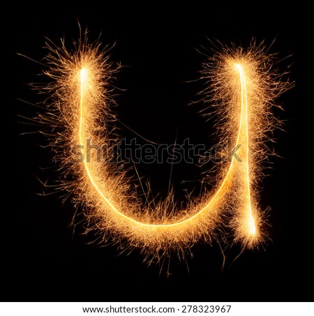 "U" letter drawn with bengali sparkles isolated on black background