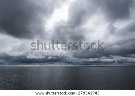 Dark clouds over gulf of Riga, Baltic sea. Royalty-Free Stock Photo #278341943