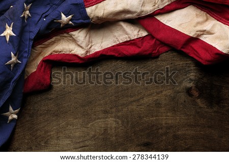 Old American flag background for Memorial Day or 4th of July Royalty-Free Stock Photo #278344139