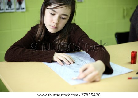 Girl drawing picture ( shallow DOF )