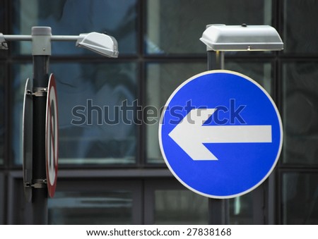 UK road traffic direction sign on urban road