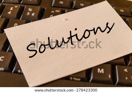 Solutions Concept on black keyboard