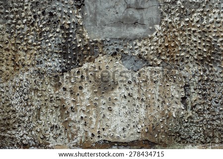 Abstract background of ruined burnt concrete wall of different colors.