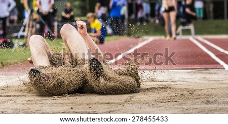 long jump in track and field Royalty-Free Stock Photo #278455433