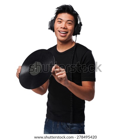 chinese man with headphones and vinyl
