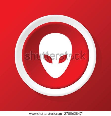 Round white icon with image of alien face, on red background