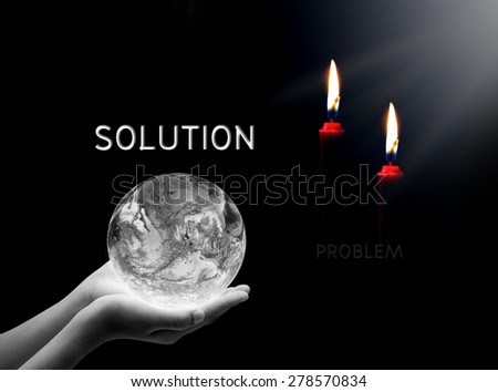 Hand holding earth and candle , solution concept , peace and spirituality ,Elements of image are furnished by NASA
