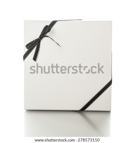 White elegant black gift box with ribbon over white background. Luxury gift service. 