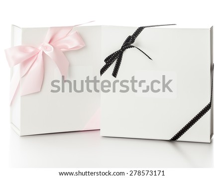 Two elegant white gift boxes with ribbons over white background. Luxury gift service. 