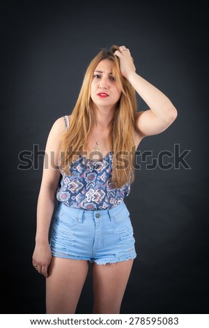 Beautiful girl doing different expressions in different sets of clothes: headache