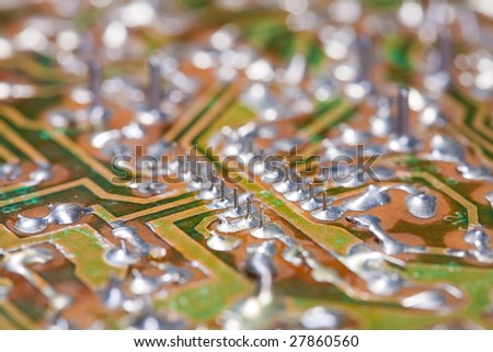 Macro picture of an electronic board with chips and other electronics components