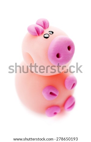 Pig made of clay isolated on white background