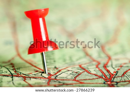Red pushpin on a tourist map for travelling Royalty-Free Stock Photo #27866239