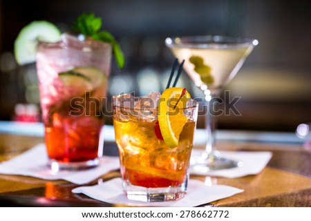 Colorful cocktails on the bar table in restaurant. Royalty-Free Stock Photo #278662772