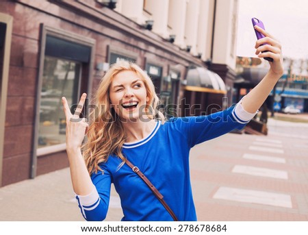 Beautiful girl taking selfie picture