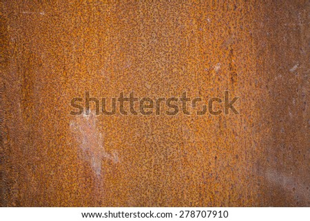 Old rusty brown metal wall closeup texture background