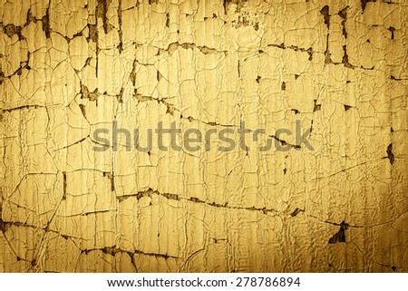 Wooden wall with cracked paint. Image vignetting and the yellow-orange toning