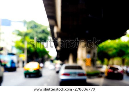 photo of blurred traffic and city background