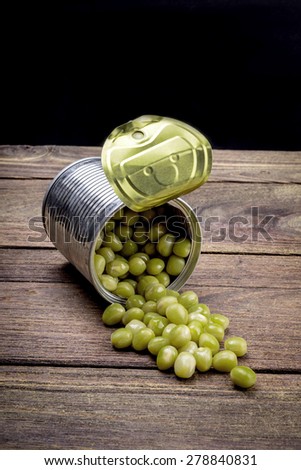 Canned Peas on vintage wooden background