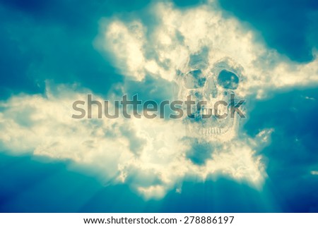 mix up of human skull with heavenly clouds and sky in cross process color  tone
