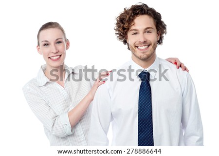Smiling woman posing behind her colleague