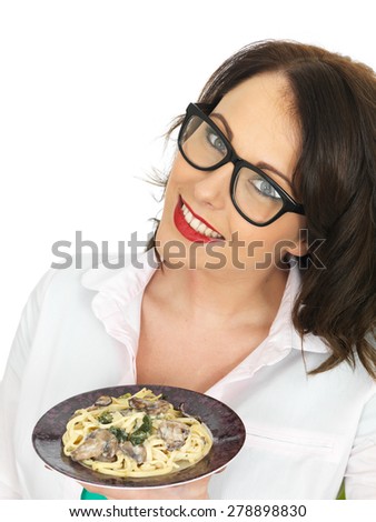 Beautiful Young Woman in Her Twenties Holding and Eating a Plate of Vegetarian Linguine With Spinach and Mushrooms