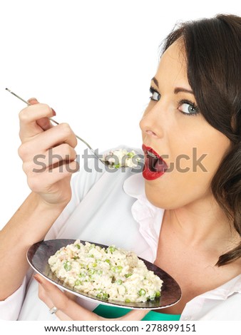Beautiful Young Woman in Her Twenties Holding a Plate of Italian Style Risotto Against a White Background