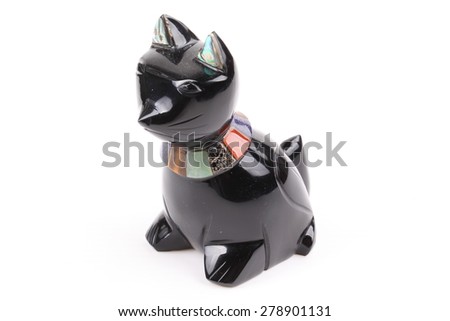 Statuette of a black cat isolated on a white background