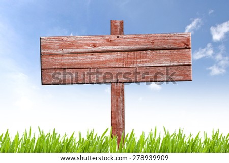 Old weathered wooden sign on nature background