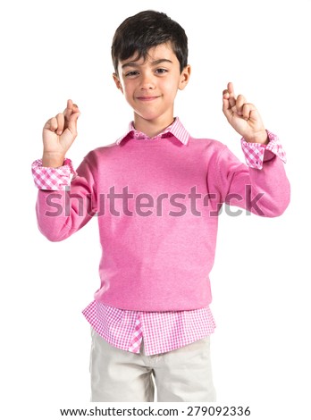 Child with his fingers crossing  