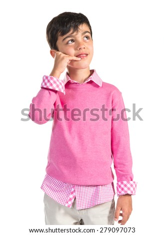Brunette child making phone gesture 