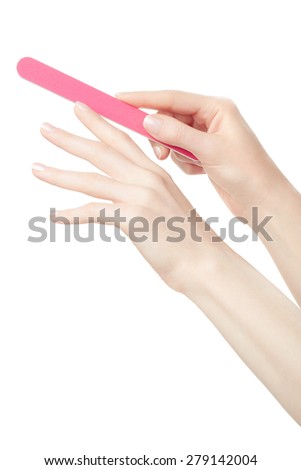 Female hands manicure with nail file isolated on white, clipping path included