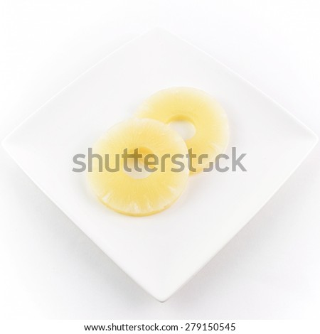 pineapple sliced on white flat