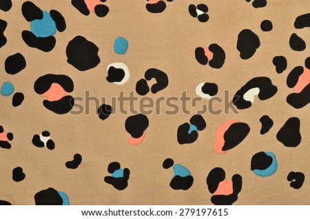 Brown leopard fur pattern. Colorful spotted animal print as background.