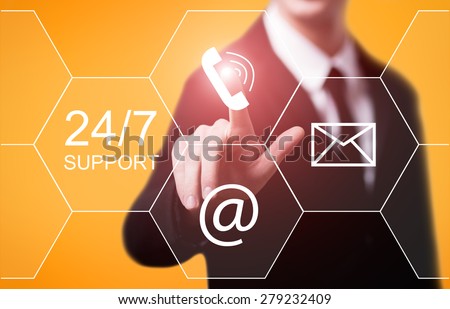 business, technology, internet and networking concept - businessman pressing 24/7 support button on virtual screens Royalty-Free Stock Photo #279232409