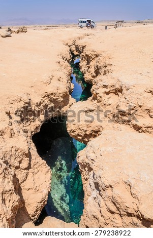 In the picture earth fracture with sea water below, situated surrounding the national park of Ras Mohammed , Egypt.