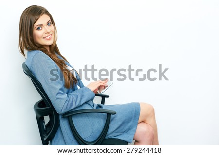 Business Woman Working with tablet, pad. Sitting in chair. isolated on white background portrait of smiling business woman.