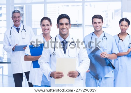 Portrait of confident doctors with arms crossed at medical office Royalty-Free Stock Photo #279290819