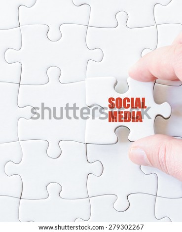 Missing jigsaw puzzle piece with word SOCIAL MEDIA. Business concept image for completing the puzzle.