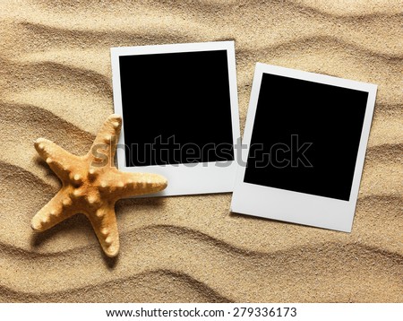 Old style empty photo card on sea sand sunny background. Close up