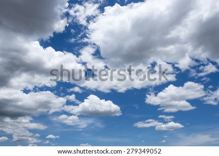 Abstract background of blue sky with white clouds and rain clouds.