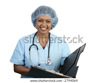 A pretty nurse in a surgical cap smiling as she reviews a chart.  Isolated on white