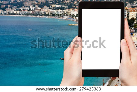 travel concept - tourist photograph Azure coast in Nice city, France on tablet pc with cut out screen with blank place for advertising logo 
