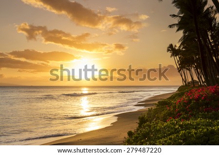 Beautiful, warm tropical sunset on the white sands of Kaanapali Beach in Maui, Hawaii. A fabulous destination for vacation and travel. Royalty-Free Stock Photo #279487220